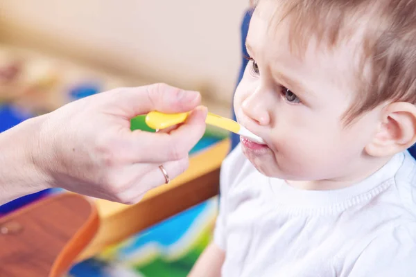 Little Cute Baby Boy Eating Chair Kitchen Mom Feeds Holding — Stock Photo, Image