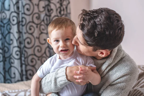 Portrait of father and son's baby. Fatherhood, love and protection of children. Family and continuity of generations — Stock Photo, Image