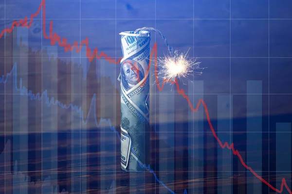 Bomb money with a burning wick with drop charts on blue background. Explosion of investment markets. Financial crisis