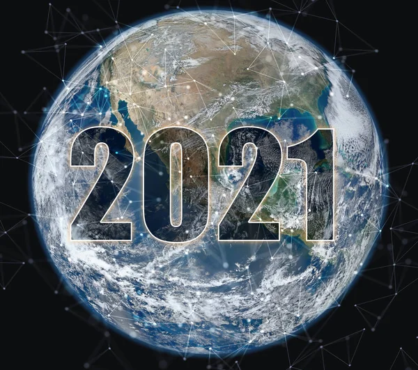 The number 2021 in space against the background of the planet earth. Year of high technologies and space development. Elements furnished by NASA