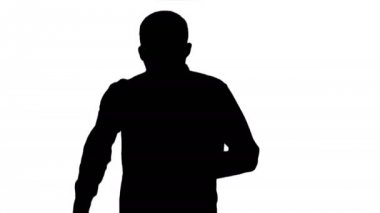 Orta boy. Siluet Adam koşmaya başlıyor, hızlanıyor. 4K çözünürlükte profesyonel atış. 004. Kullanabilirsin, mesela. ticari videonuzda, işinizde, sunumunuzda, yayınınızda 