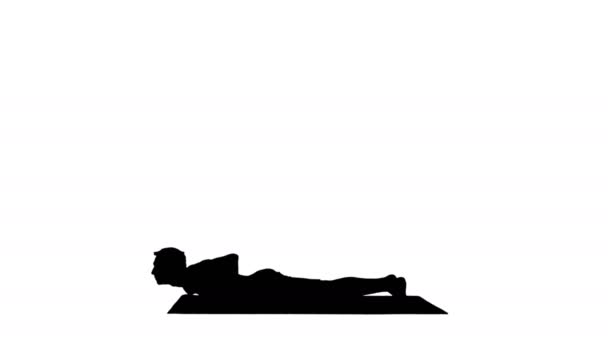 Silhouet Knappe man doet yoga asanas. — Stockvideo