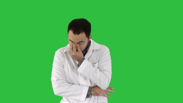 Yawning doctor with hand covering mouth, tired, stressed on a Green Screen, Chroma Key. — Stock Video