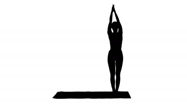 Silhouette Γυναίκα εξάσκηση γιόγκα, στέκεται σε εκτεταμένη πλευρά γωνία άσκηση, Utthita parsvakonasana θέτουν. — Αρχείο Βίντεο