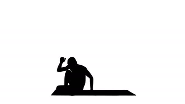 Silhouette Man practicing yoga, stretching torso. — Stock Video