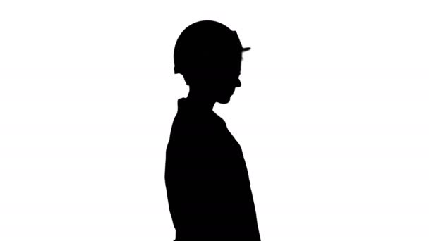 Silhouette Scientist physicist woman walking in lab coat and hardhat. — Stock Video