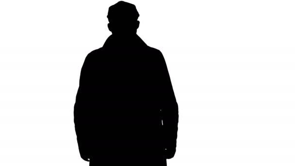 Silhouette Fashionable man with dark beard in trench coat walking. — Stock Video