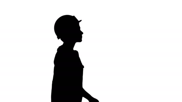 Silhouette Νεαρή γυναίκα σε κίτρινο hardhat περπάτημα. — Αρχείο Βίντεο