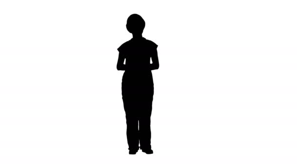 Silhouet van jonge glimlachend werknemer vrouw presenter duwen imaginaire knoppen van beide kant. — Stockvideo