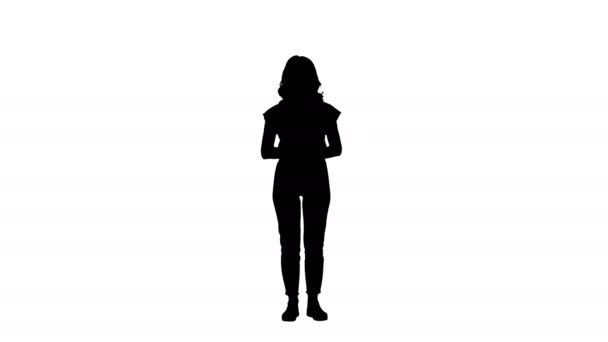 Silhouette Beautiful woman presenter showing imaginary images from her left and right. — Stock Video