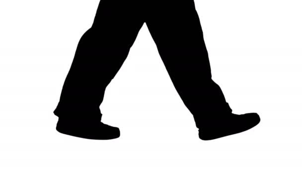 歩いている女性建設労働者のシルエット足. — ストック動画