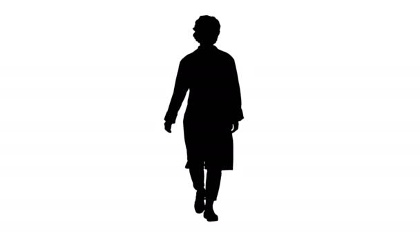 Силуэт Улыбающийся педиатр, держащийся за руки в карманах униформы и ходьбе . — стоковое видео