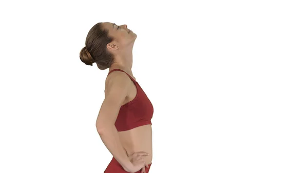 Femmina camminare e fare esercizio di stretching del collo per rilasciare costruire tensione su sfondo bianco . — Foto Stock
