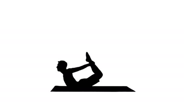 Silhouette Jeune homme yogi musclé et sportif faisant de l'exercice de backbend, dhanurasana, posture d'arc . — Video