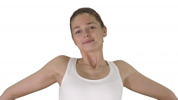 Contented happy young woman stretching her arms while walking on white background. — Stock Video