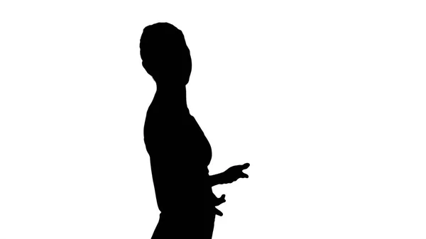 Silhouette Yoga teacher walking and explaining. — Stock Photo, Image