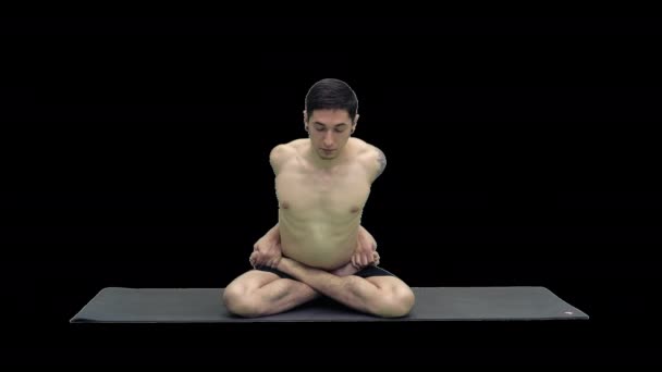 Young man practicing yoga in lotus position, Alpha Channel