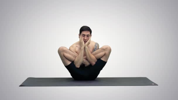 Practicing Yoga exercises Scale Pose - Tolasana on gradient background. — Stock Video