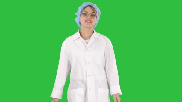 Nice Blonde Woman Doctor Walking on a Green Screen, Chroma Key. — Stock Video