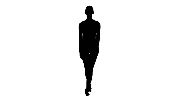 Silhouette junge Frau läuft in weißen Sportklamotten barfuß und lächelt breit. — Stockfoto