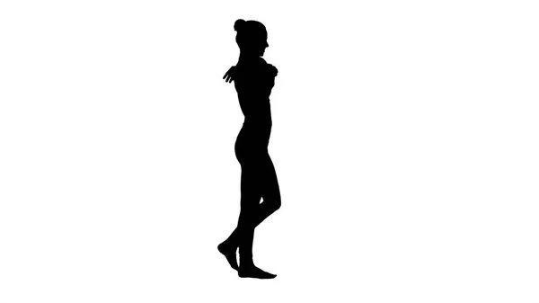 Silhouette Feminine Sportlerin streckt beim Gehen die Arme aus. — Stockfoto