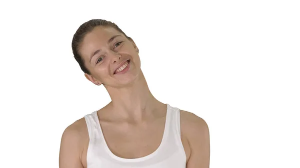 Happy young woman looking at camera with smile while walking on white background. — Stock Photo, Image