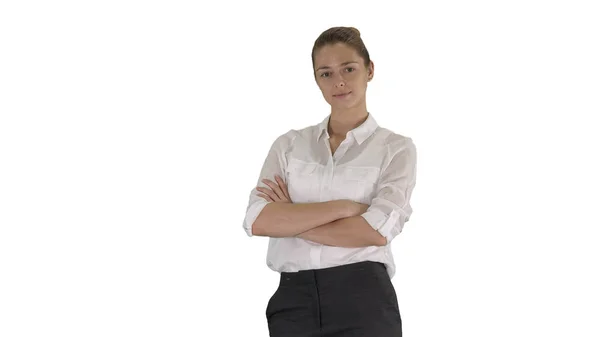 Mooie jonge vrouw in formele shirt kruising armen op witte achtergrond. — Stockfoto