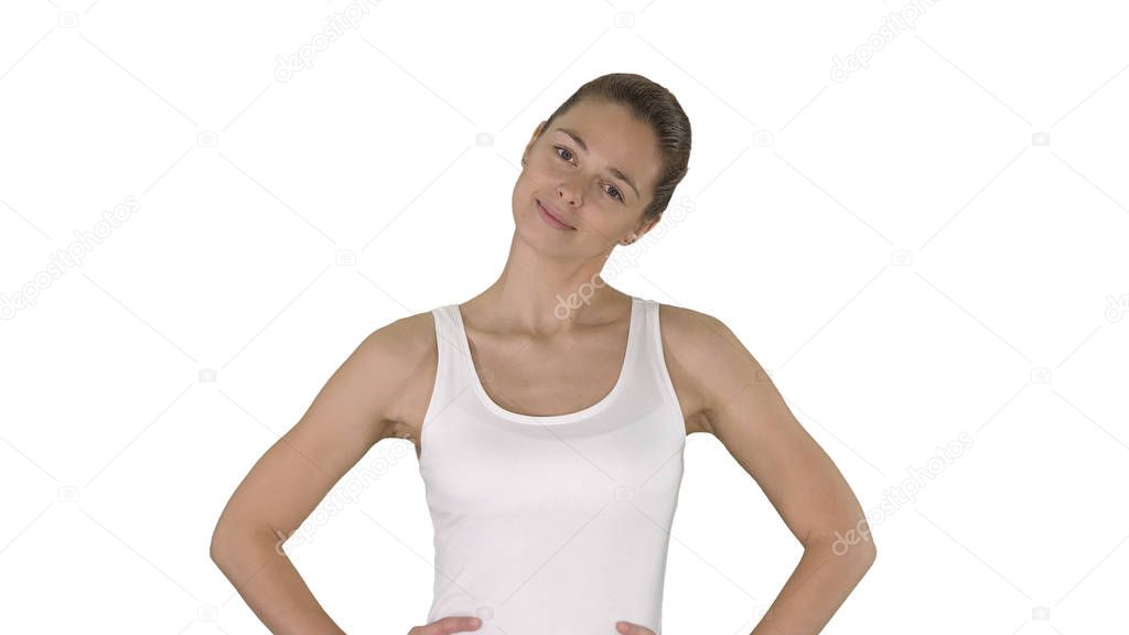 Woman stretching neck while walking on white background.