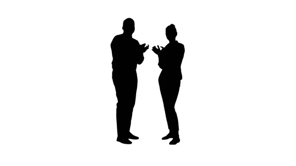 Silhouette Ein Geschäftsmann und eine Geschäftsfrau applaudieren. — Stockfoto