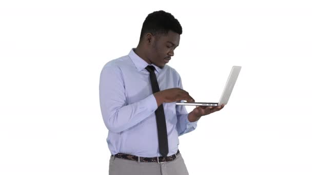 Afro American business man working with laptop on white background. — Stock Video