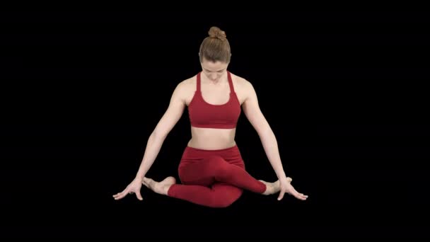 Yoga girl practicing nadi shodhana pranayama or Breathingin in gomukhasana asana or cow head pose, Alpha Channel — Stock Video