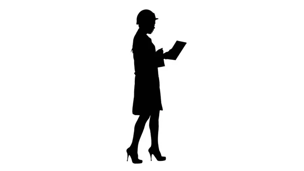 Silhouette Woman engineer with tablet making video call. — Stock Photo, Image