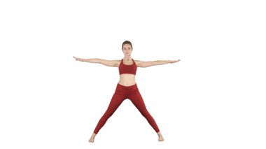 İleri asana yoga poz beyaz arka plan üzerinde bükme genç kadın.