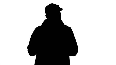Silhouette Confident young handsome man walking and saying to camera. That is it. clipart