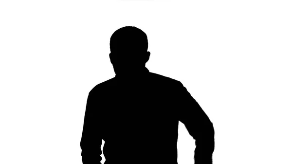 Silhouet Jongeman probeert bij te praten. — Stockfoto