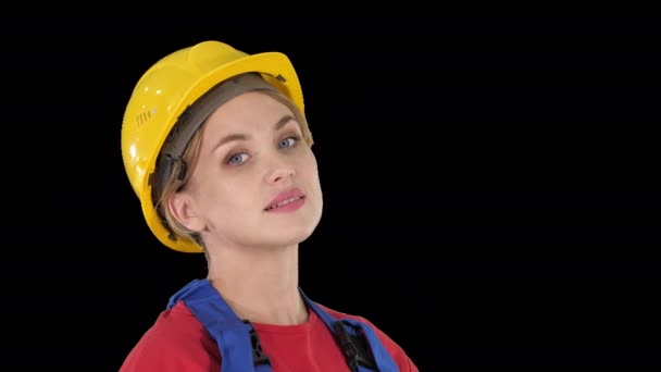 Female construction worker greeting, Alpha Channel — Stock Video