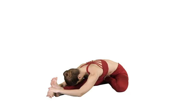 年轻的有吸引力的女人练习瑜伽, 坐在头到膝盖前进弯道锻炼, J间 u Sirsasana 姿势在白色背景. — 图库照片
