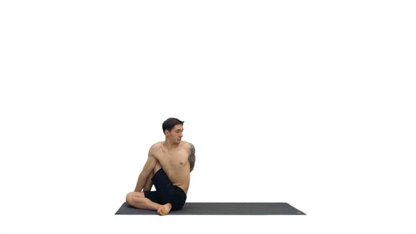 Man utövar yoga, stretching bål på vit bakgrund. — Stockfoto