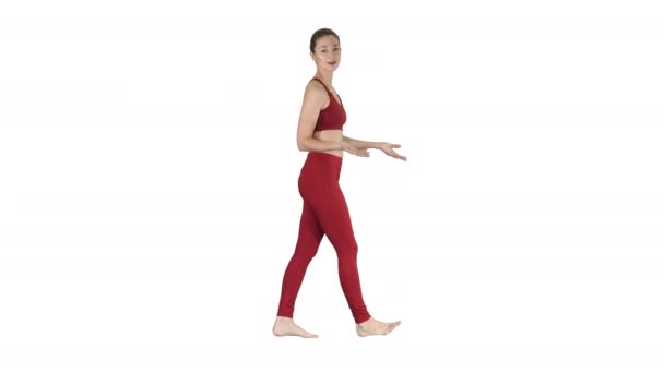 Yoga trainer talking to camera on white background. — Stock Video