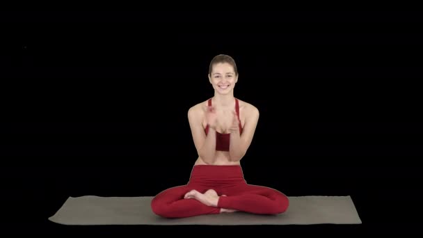 Positive cheerful young female in yoga pose clapping hands and smiling, Alpha Channel — Stock Video