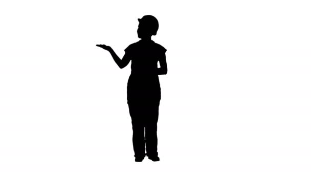 Silhouet volwassen ingenieur vrouw presenteren van een product wijzen naar kant. — Stockvideo