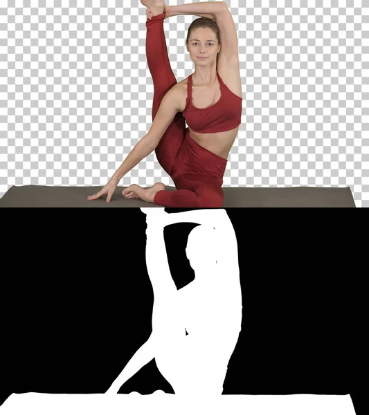 Sportliches Yogi-Mädchen beim Fitnesstraining, Stretching, Yoga Asana Parivritta Kraunchasana, Reiherstellung, Alphakanal — Stockfoto