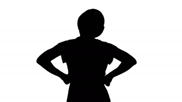 Silhouette Female construction worker with hands on hips looking at something. — Stock Video