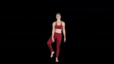 Yoga yapan genç yogi kadın, Utthita Hasta Padangushthasana pozu, Trivikramasana, ayakta bölünmeler, Alpha Channel