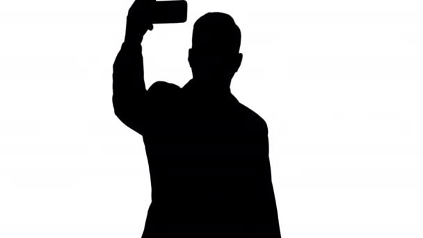 Silhouet Zakenman neemt selfie. — Stockvideo
