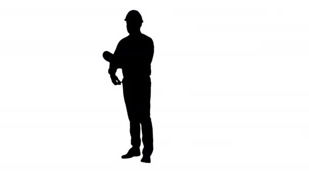 Silhouette Engineer checking construction plan with what is built. — Stock Video