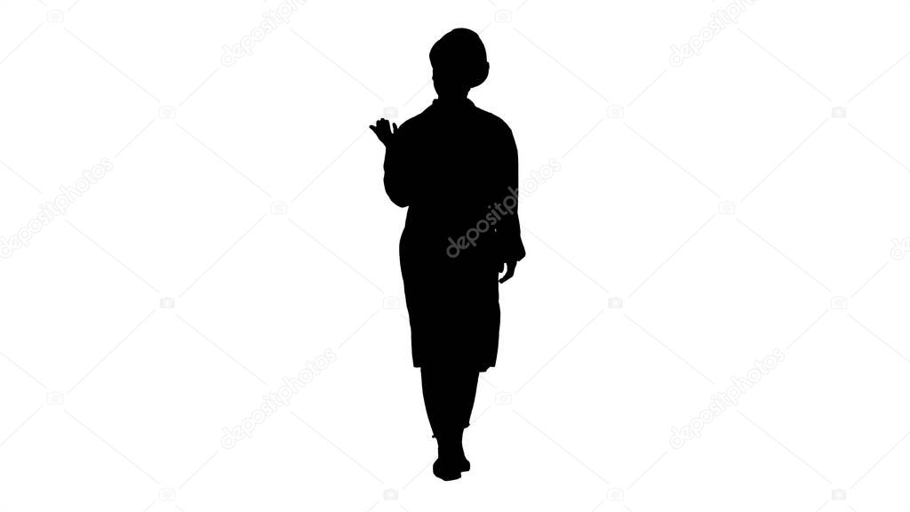 Silhouette Young female engineer or architect making presenting gestures and talks.