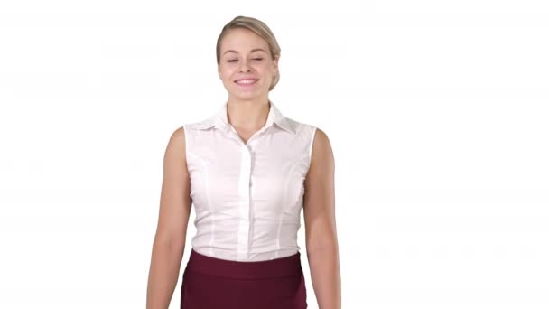 Portrait of a young beautiful girl standing looking shy on white background. — Stock Video