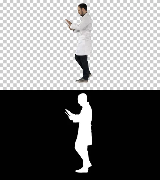 Doctor using tab while walking, Alpha Channel