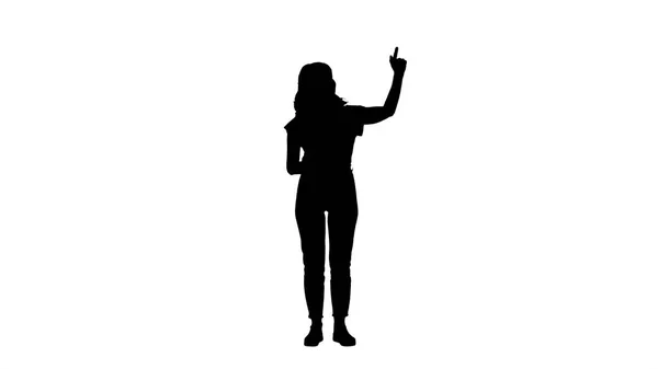 Silhouette Smiling woman in casual clothes presenting something, pushing imaginary buttons. — Stock Photo, Image